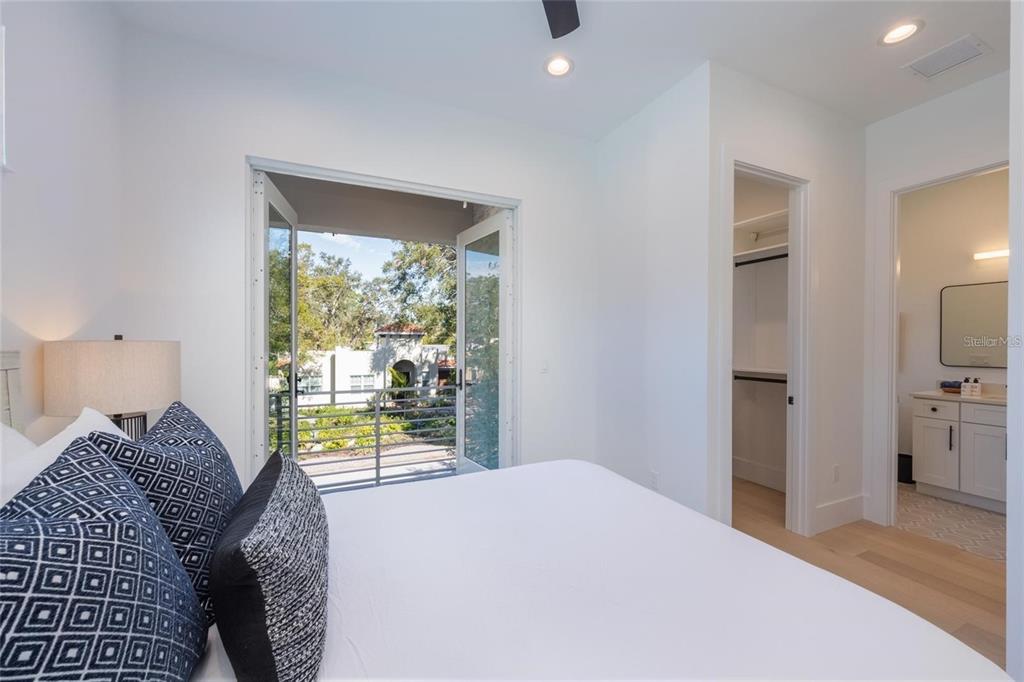2446 Floyd Street Sarasota, FL 34239 - Photo 52 of 70 a bedroom with a bed and a large window