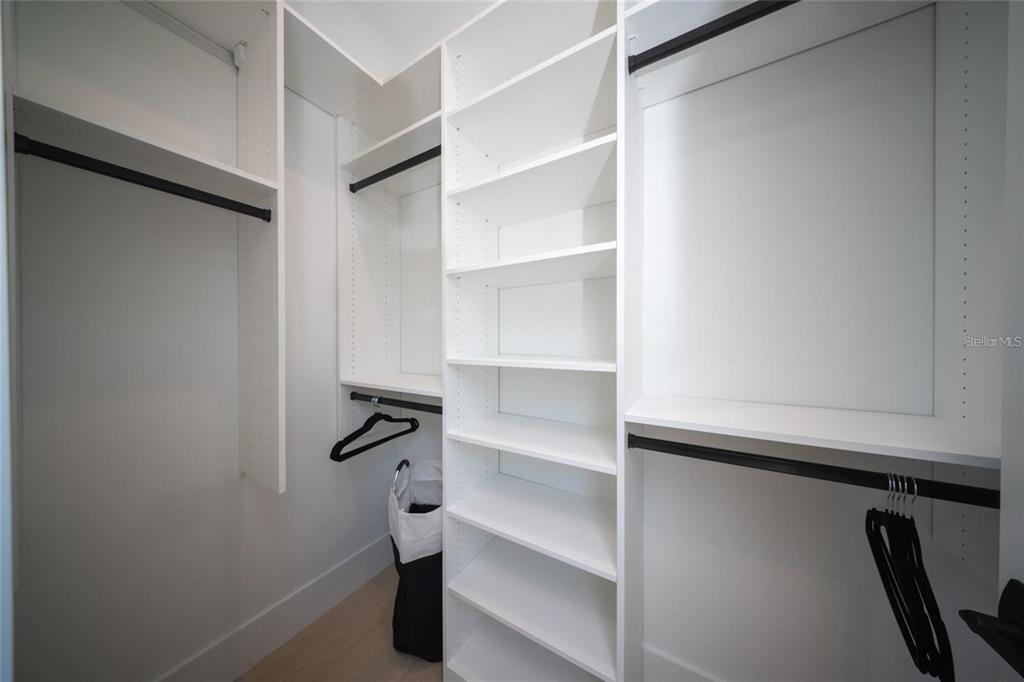 2446 Floyd Street Sarasota, FL 34239 - Photo 55 of 70 a view of walk in closet with empty racks