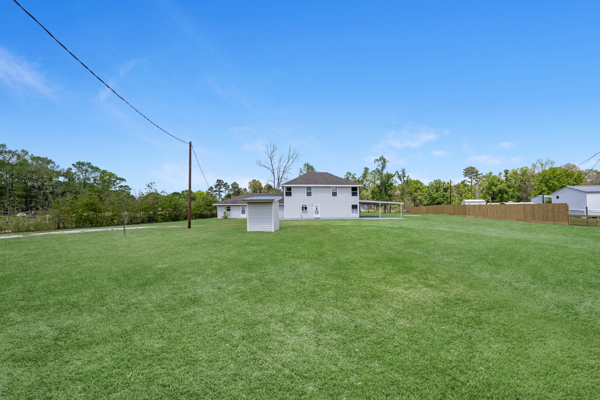 16511 Edgefield Lane Conroe, TX 77302 - Photo 42 of 42 a view of a house with a big yard