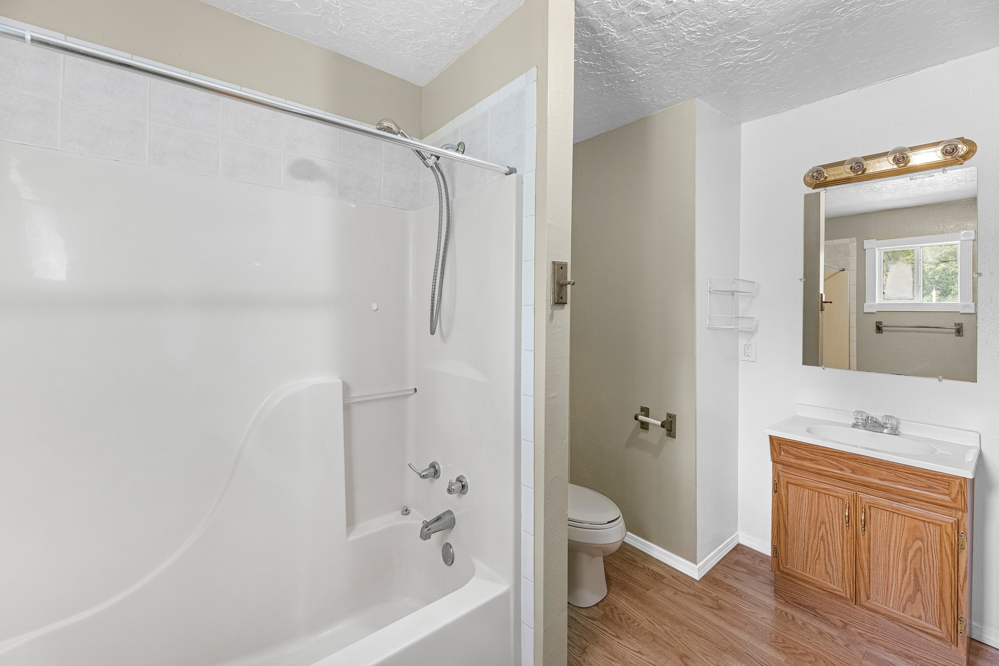 16511 Edgefield Lane Conroe, TX 77302 - Photo 8 of 42 a bathroom with a shower a sink and a mirror