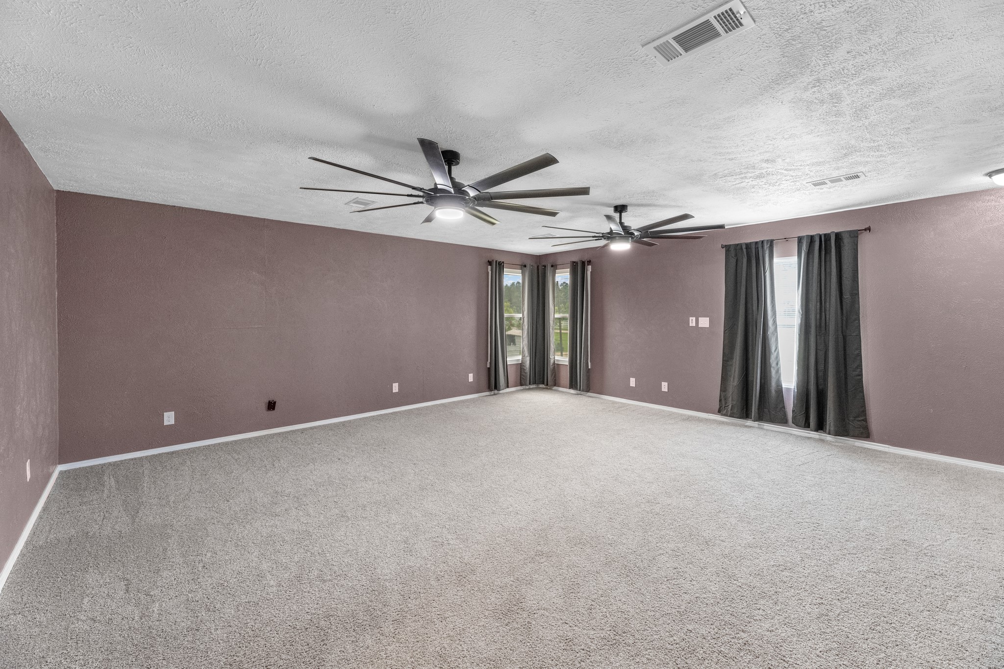16511 Edgefield Lane Conroe, TX 77302 - Photo 9 of 42 a view of an empty room with a ceiling fan