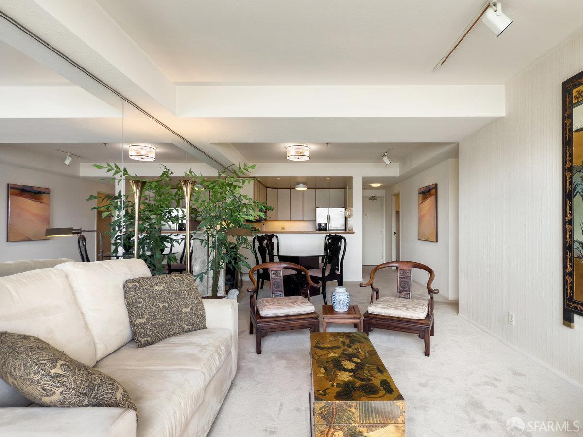 601 Van Ness Avenue, Unit 750 San Francisco, CA 94102 - Photo 11 of 37 a living room with furniture and a fireplace