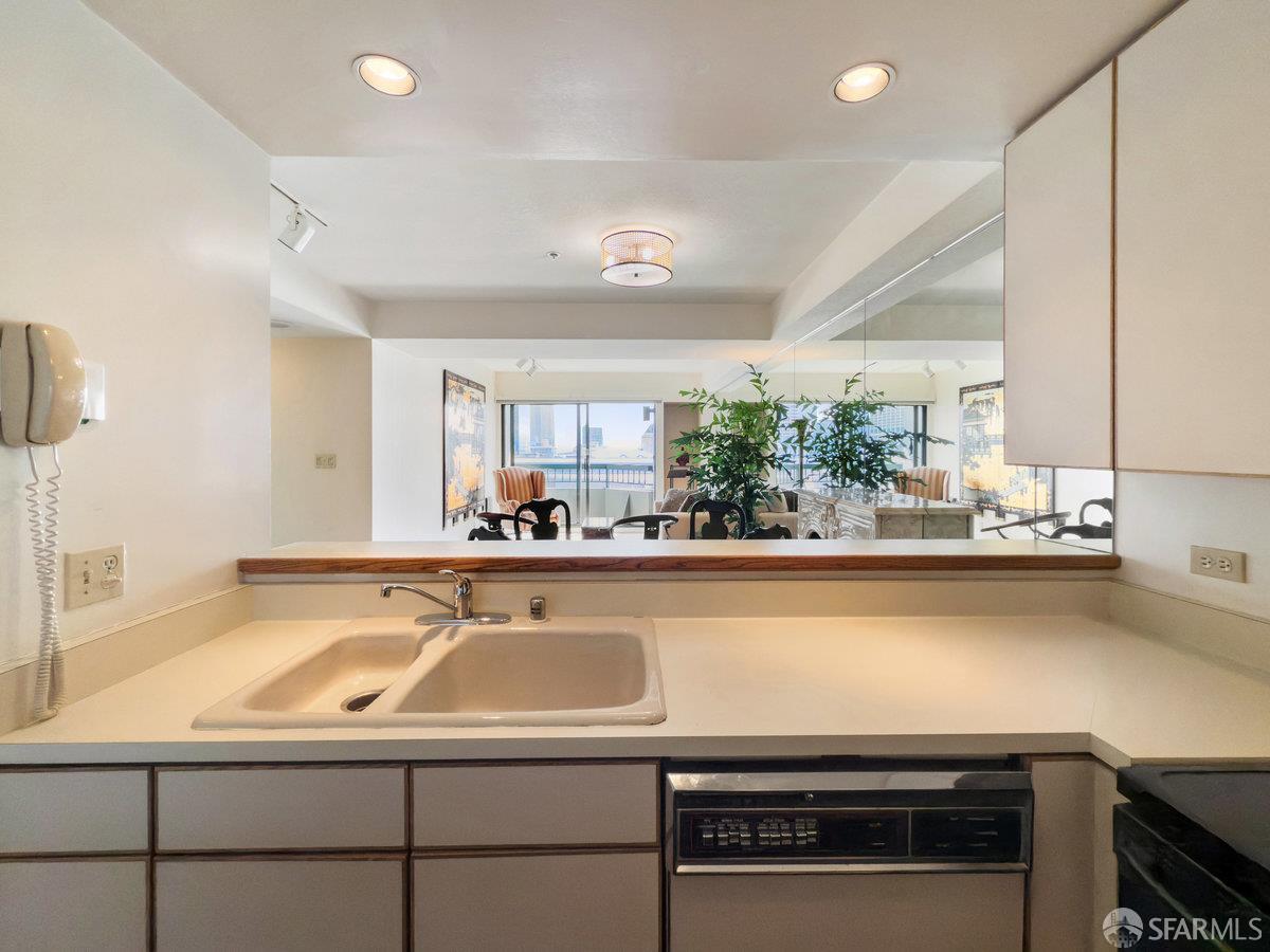601 Van Ness Avenue, Unit 750 San Francisco, CA 94102 - Photo 12 of 37 a view of a kitchen counter top space cabinets stainless steel appliances and windows