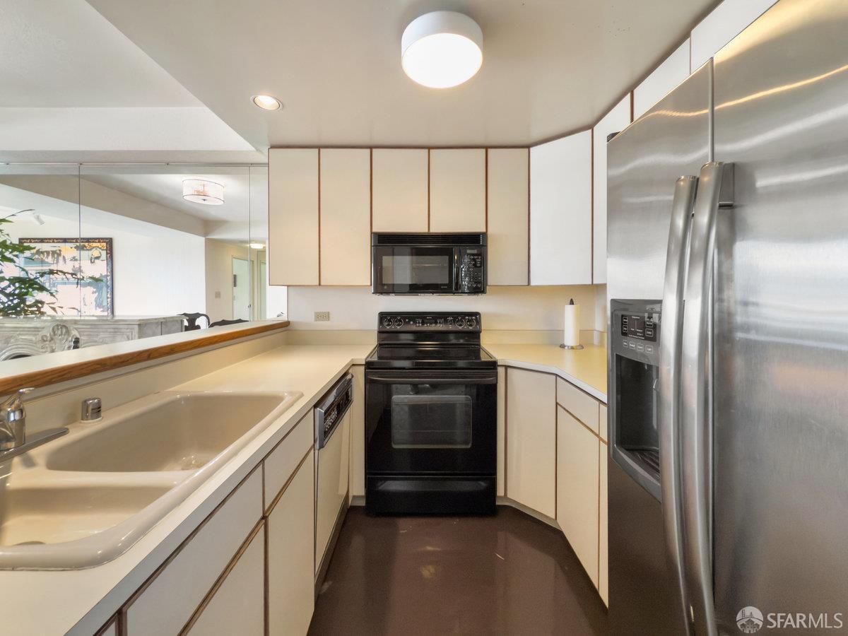 601 Van Ness Avenue, Unit 750 San Francisco, CA 94102 - Photo 13 of 37 a kitchen with a refrigerator and a sink