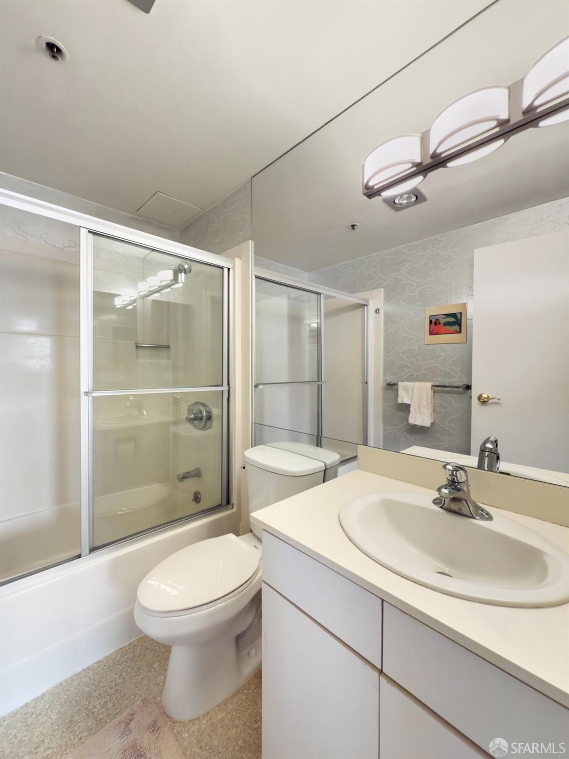 601 Van Ness Avenue, Unit 750 San Francisco, CA 94102 - Photo 16 of 37 a bathroom with a sink a toilet and shower