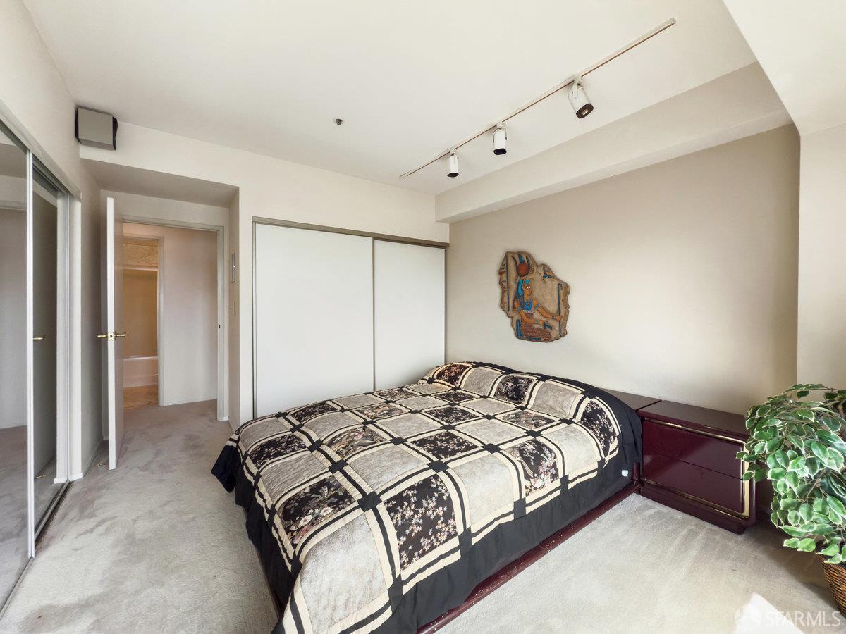 601 Van Ness Avenue, Unit 750 San Francisco, CA 94102 - Photo 18 of 37 a bedroom with a bed and window