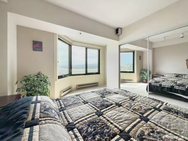 a bedroom with furniture and windows