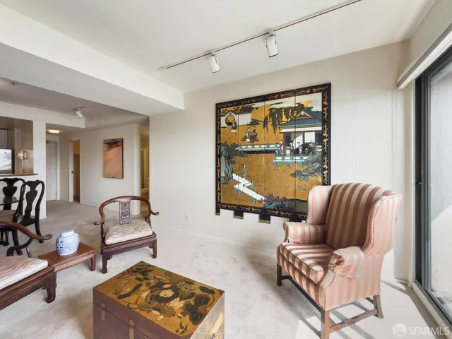 a living room with furniture and a window