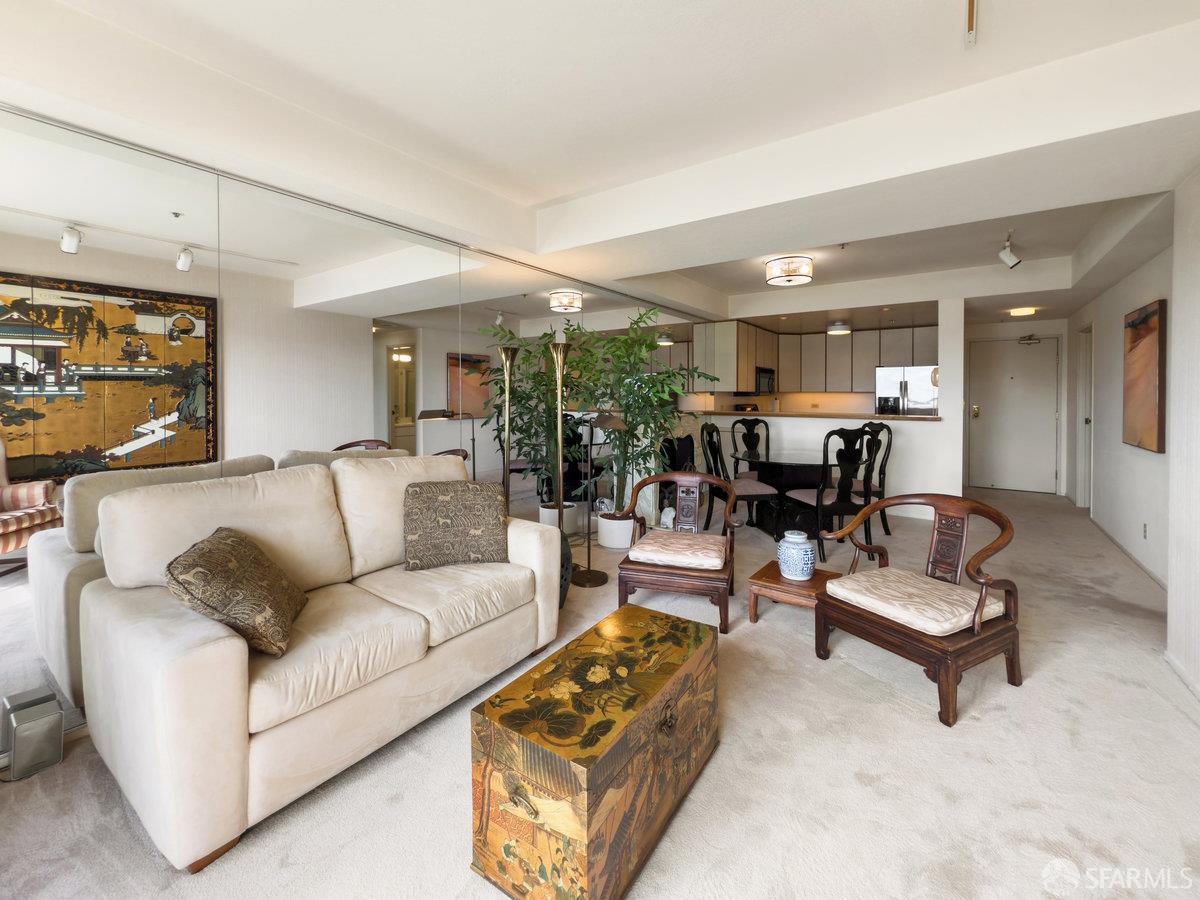 601 Van Ness Avenue, Unit 750 San Francisco, CA 94102 - Photo 5 of 37 a living room with furniture and kitchen view