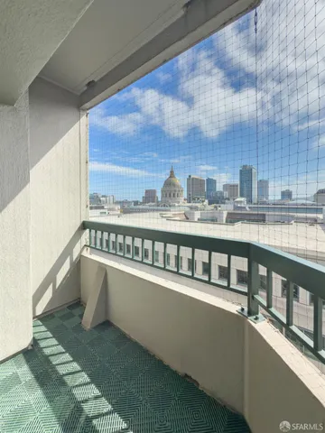 a view of a balcony with city view