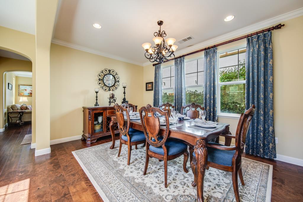7670 MacKenzie Way Gilroy, CA 95020 - Photo 14 of 70 a view of a dining room with furniture window and wooden floor