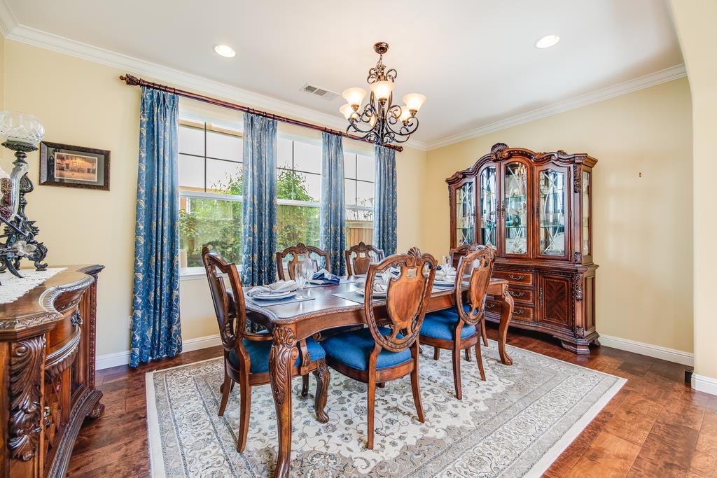7670 MacKenzie Way Gilroy, CA 95020 - Photo 16 of 70 a view of a dining room with furniture window and wooden floor