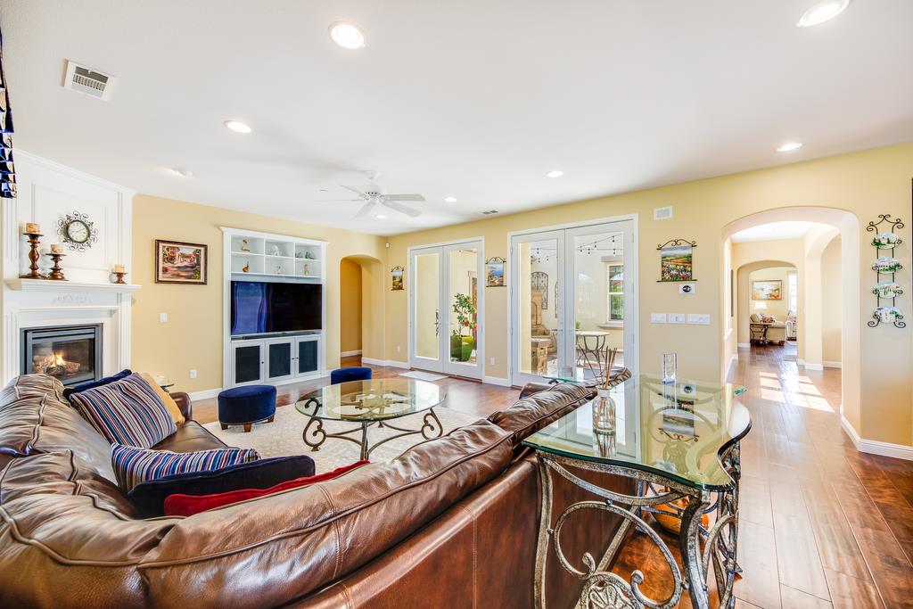 7670 MacKenzie Way Gilroy, CA 95020 - Photo 18 of 70 a living room with furniture fireplace and flat screen tv