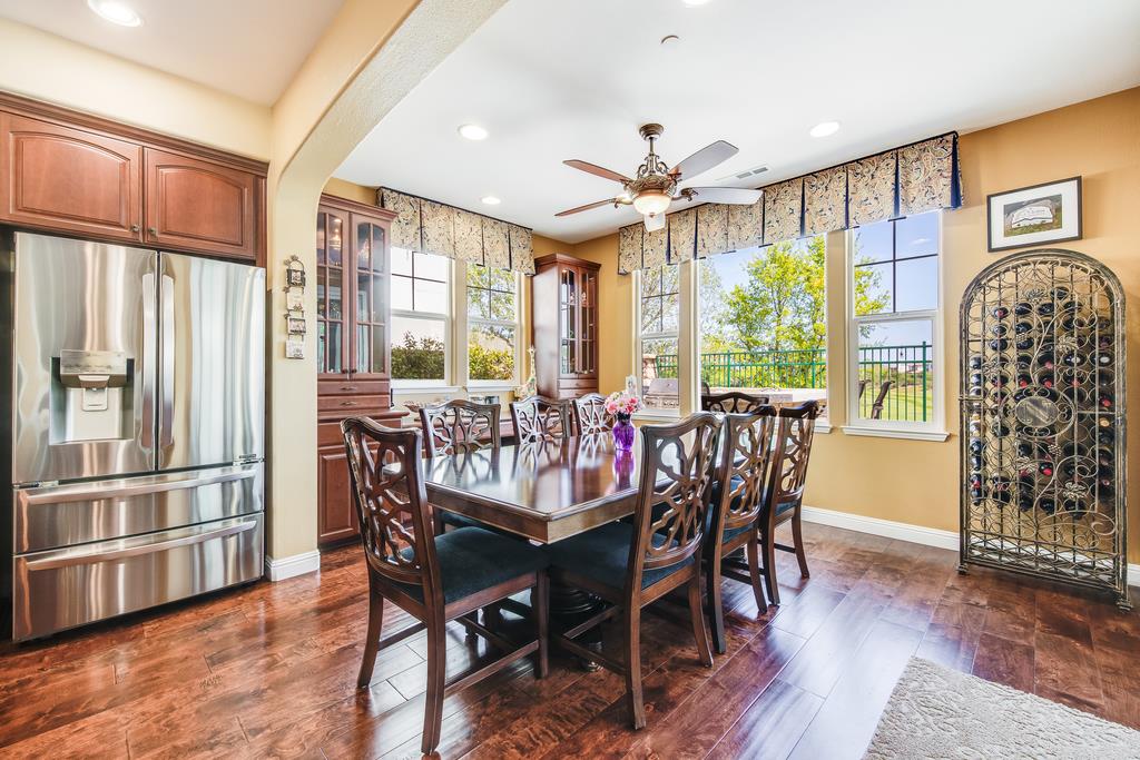 7670 MacKenzie Way Gilroy, CA 95020 - Photo 26 of 70 a view of a dining room with furniture window and wooden floor