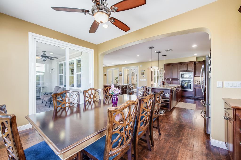 7670 MacKenzie Way Gilroy, CA 95020 - Photo 29 of 70 a view of a dining room with furniture and wooden floor