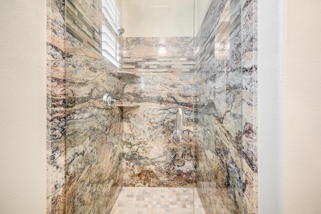 7670 MacKenzie Way Gilroy, CA 95020 - Photo 36 of 70 a bathroom with a shower curtain