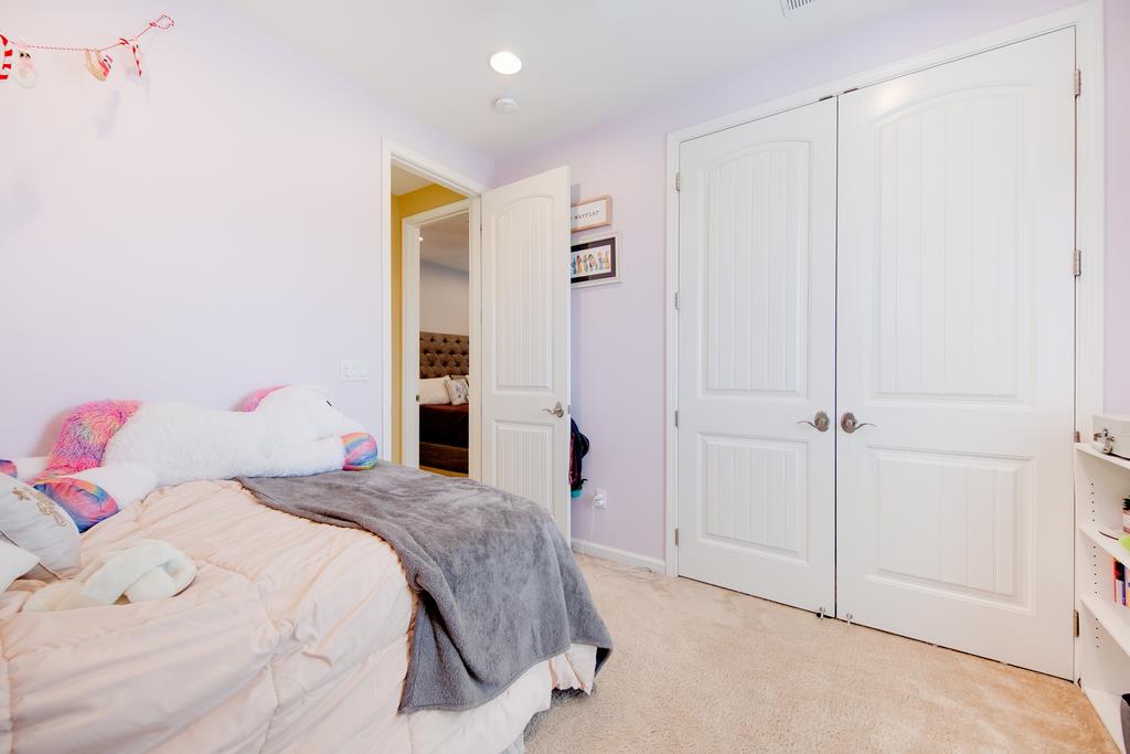 7670 MacKenzie Way Gilroy, CA 95020 - Photo 42 of 70 a bedroom with a bed and a cabinets