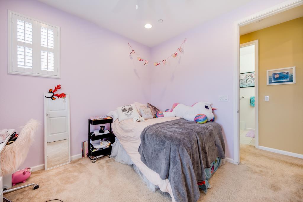 7670 MacKenzie Way Gilroy, CA 95020 - Photo 44 of 70 a bedroom with two beds and a closet