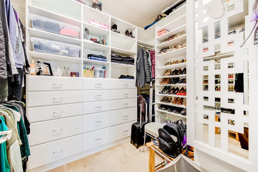 7670 MacKenzie Way Gilroy, CA 95020 - Photo 56 of 70 a view of walk in closet with clothes and shoes