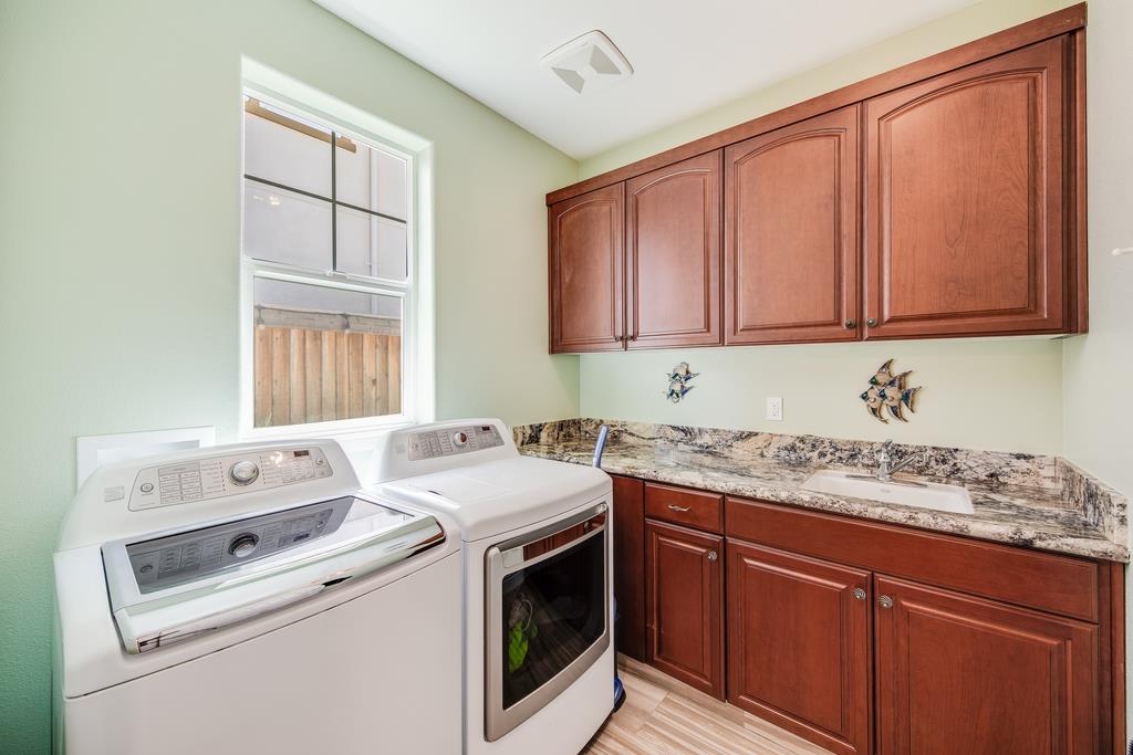 7670 MacKenzie Way Gilroy, CA 95020 - Photo 60 of 70 a utility room with sink dryer and washer