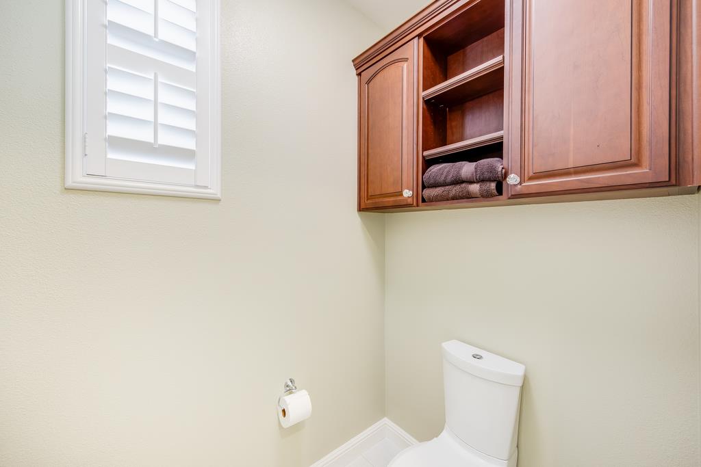 7670 MacKenzie Way Gilroy, CA 95020 - Photo 61 of 70 a bathroom with a toilet sink and mirror