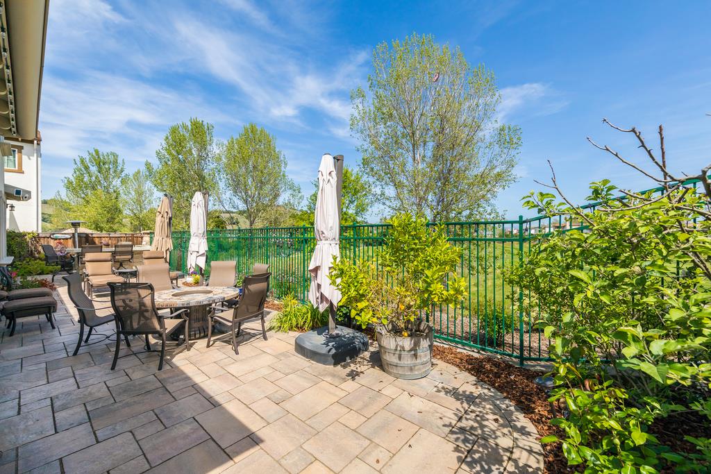 7670 MacKenzie Way Gilroy, CA 95020 - Photo 64 of 70 a view of a patio with table and chairs and potted plants