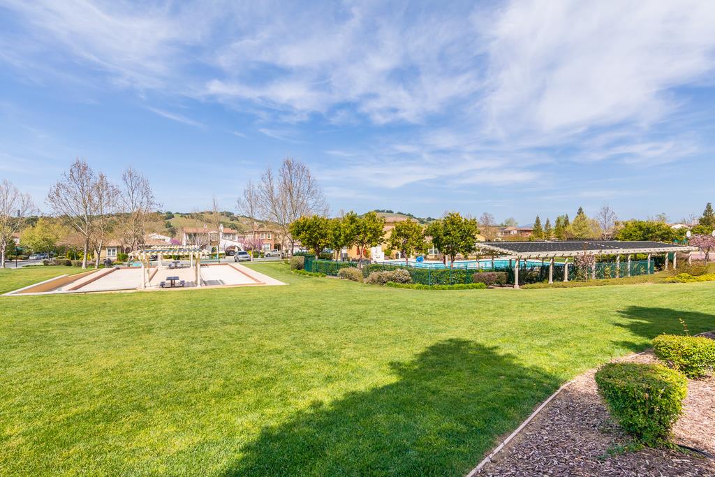 7670 MacKenzie Way Gilroy, CA 95020 - Photo 69 of 70 a view of a house with a big yard and a large pool table and chairs