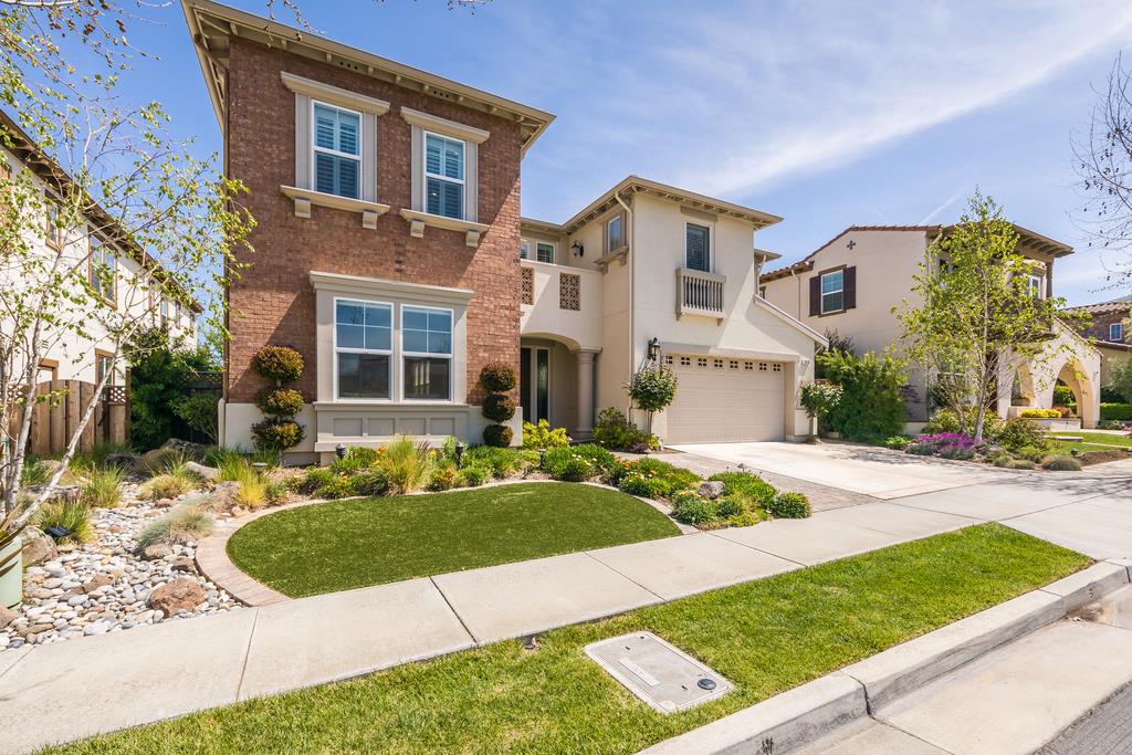 7670 MacKenzie Way Gilroy, CA 95020 - Photo 8 of 70 a front view of a house with a yard