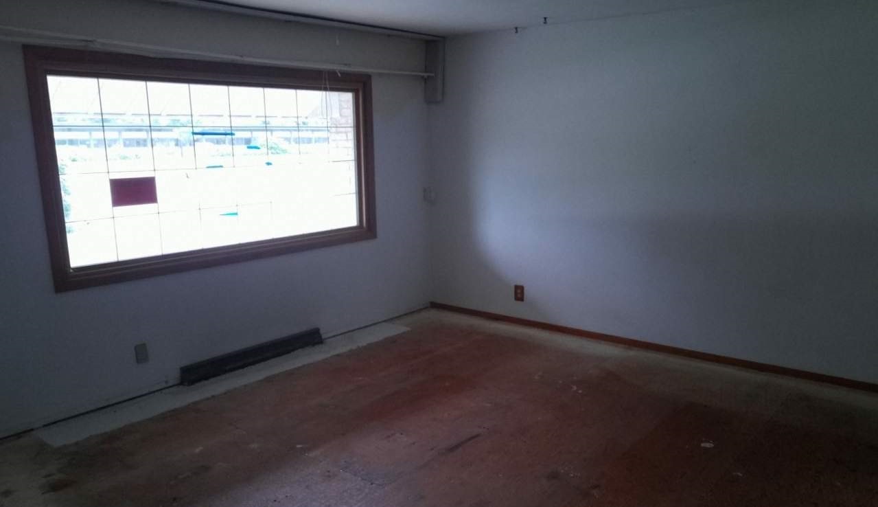 724 Windsor Road Loves Park, IL 61111 - Photo 2 of 11 a view of an empty room with a window