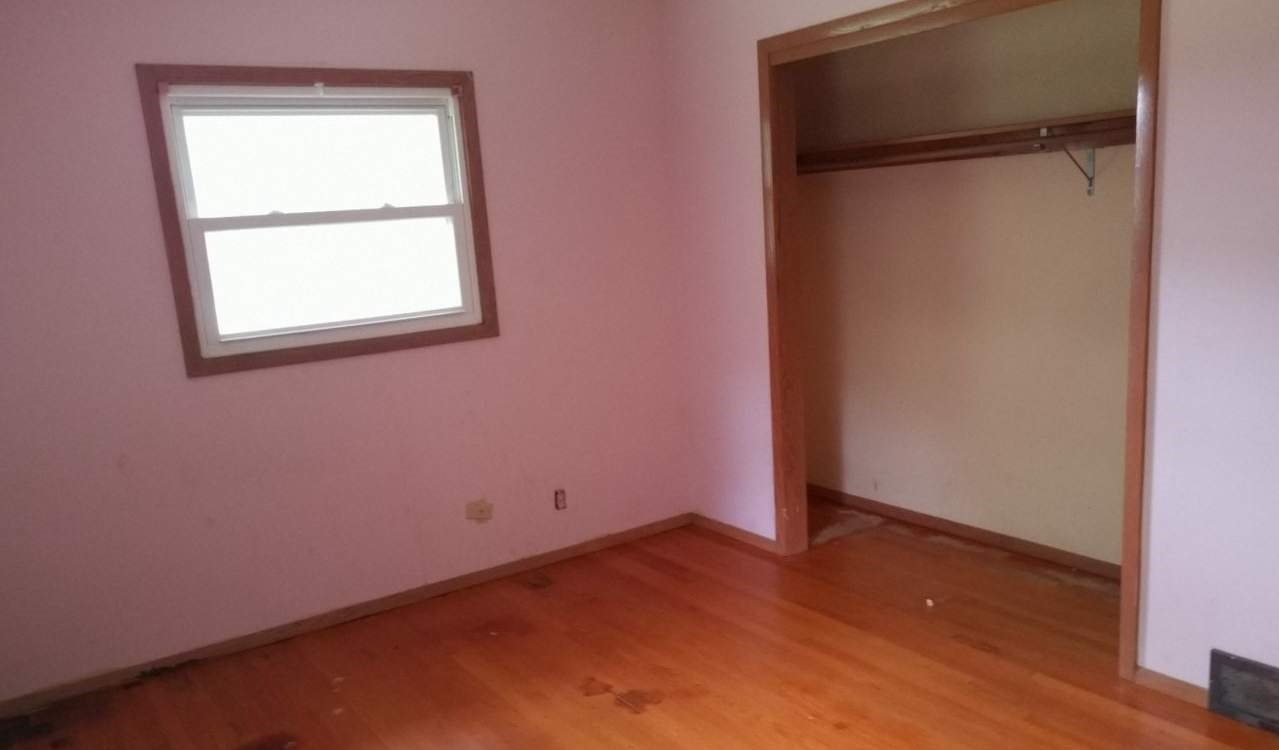 724 Windsor Road Loves Park, IL 61111 - Photo 7 of 11 an empty room with a window
