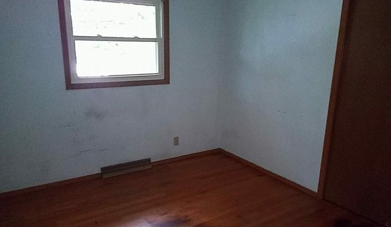 724 Windsor Road Loves Park, IL 61111 - Photo 9 of 11 an empty room with a window