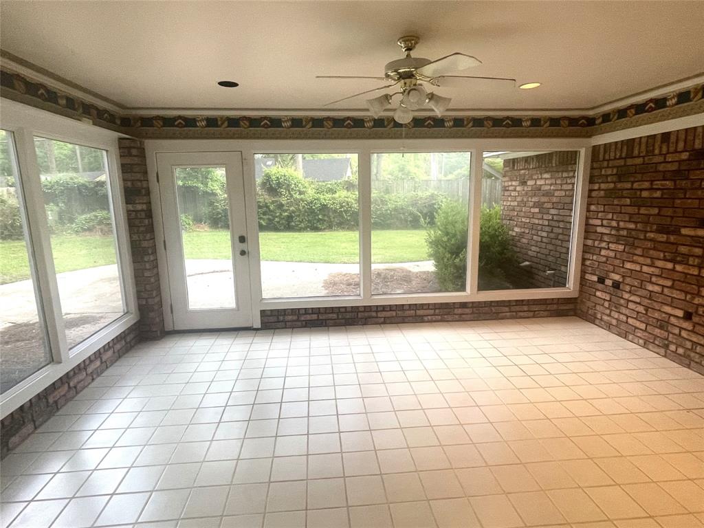 720 Coachlight Road Shreveport, LA 71106 - Photo 11 of 22 a view of empty room with wooden floor and fan