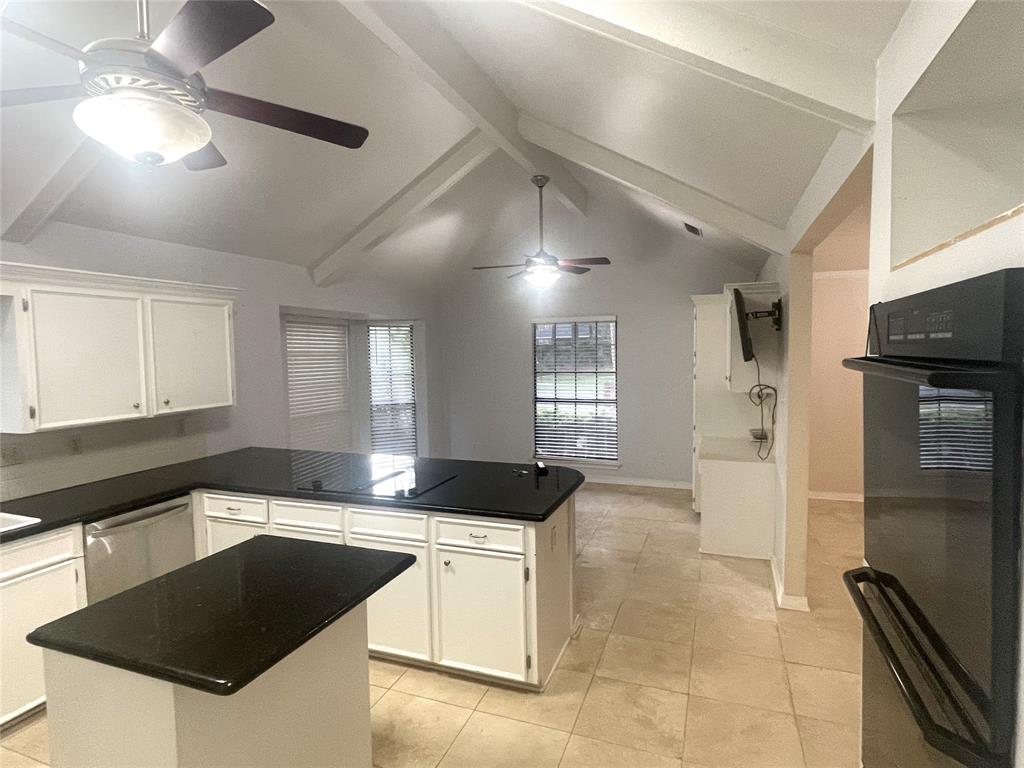 720 Coachlight Road Shreveport, LA 71106 - Photo 7 of 22 a kitchen with a sink a counter top space and stainless steel appliances