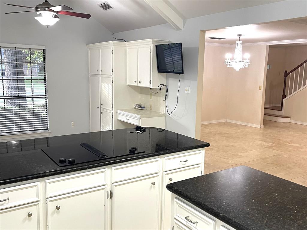 720 Coachlight Road Shreveport, LA 71106 - Photo 8 of 22 a kitchen with a sink a counter top space cabinets and stainless steel appliances