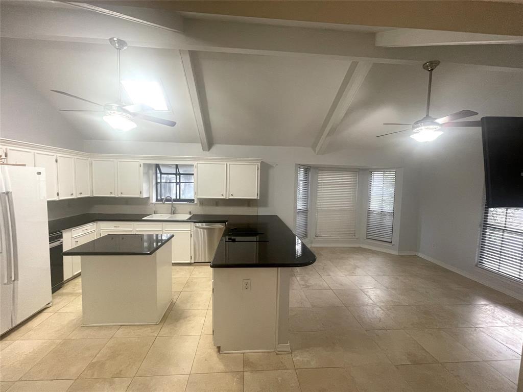 720 Coachlight Road Shreveport, LA 71106 - Photo 9 of 22 a kitchen with a cabinets and white stainless steel appliances