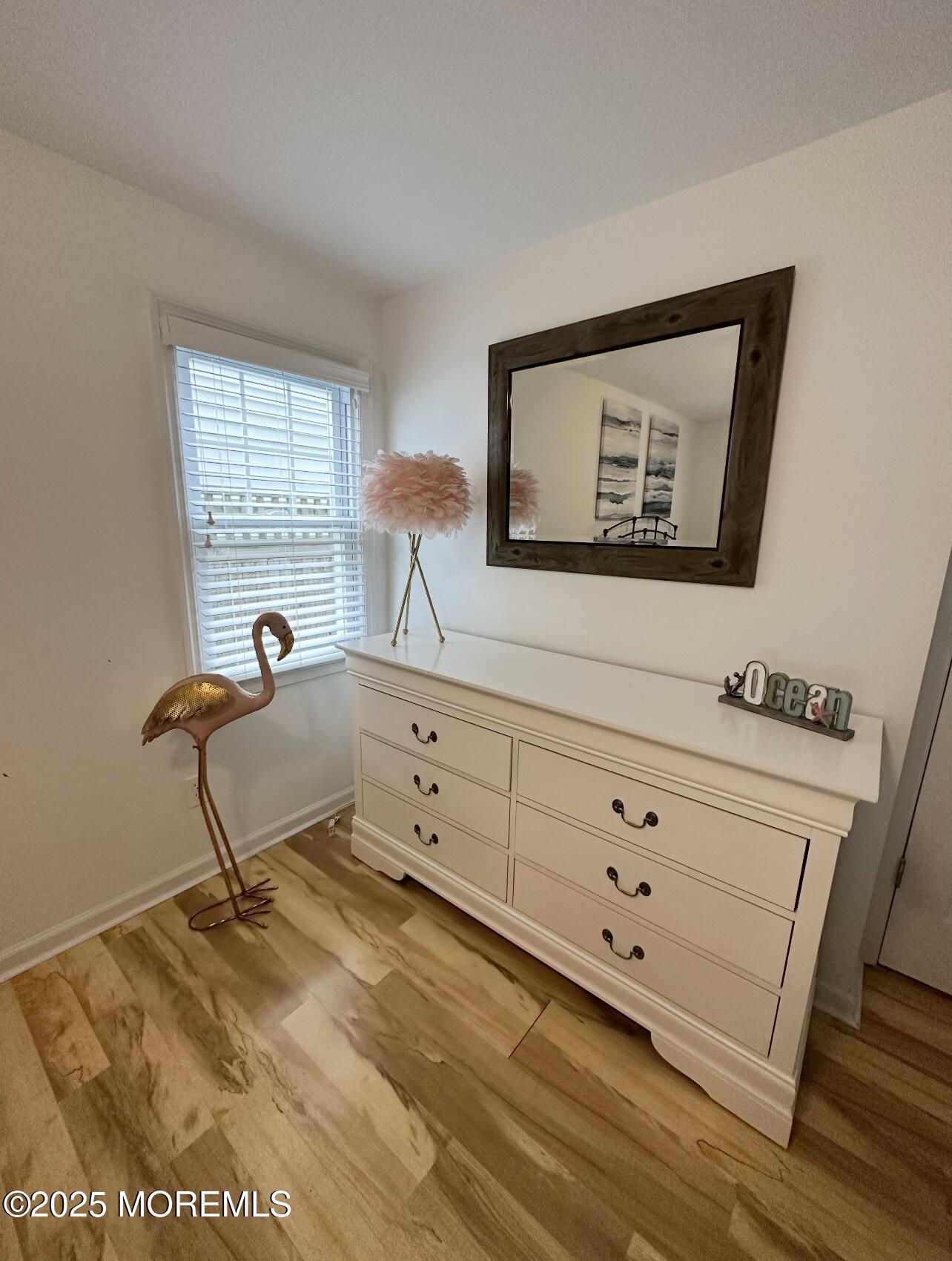 7 Princeton Avenue Lavallette, NJ 08735 - Photo 12 of 17 a room with painting on the wall and a dresser