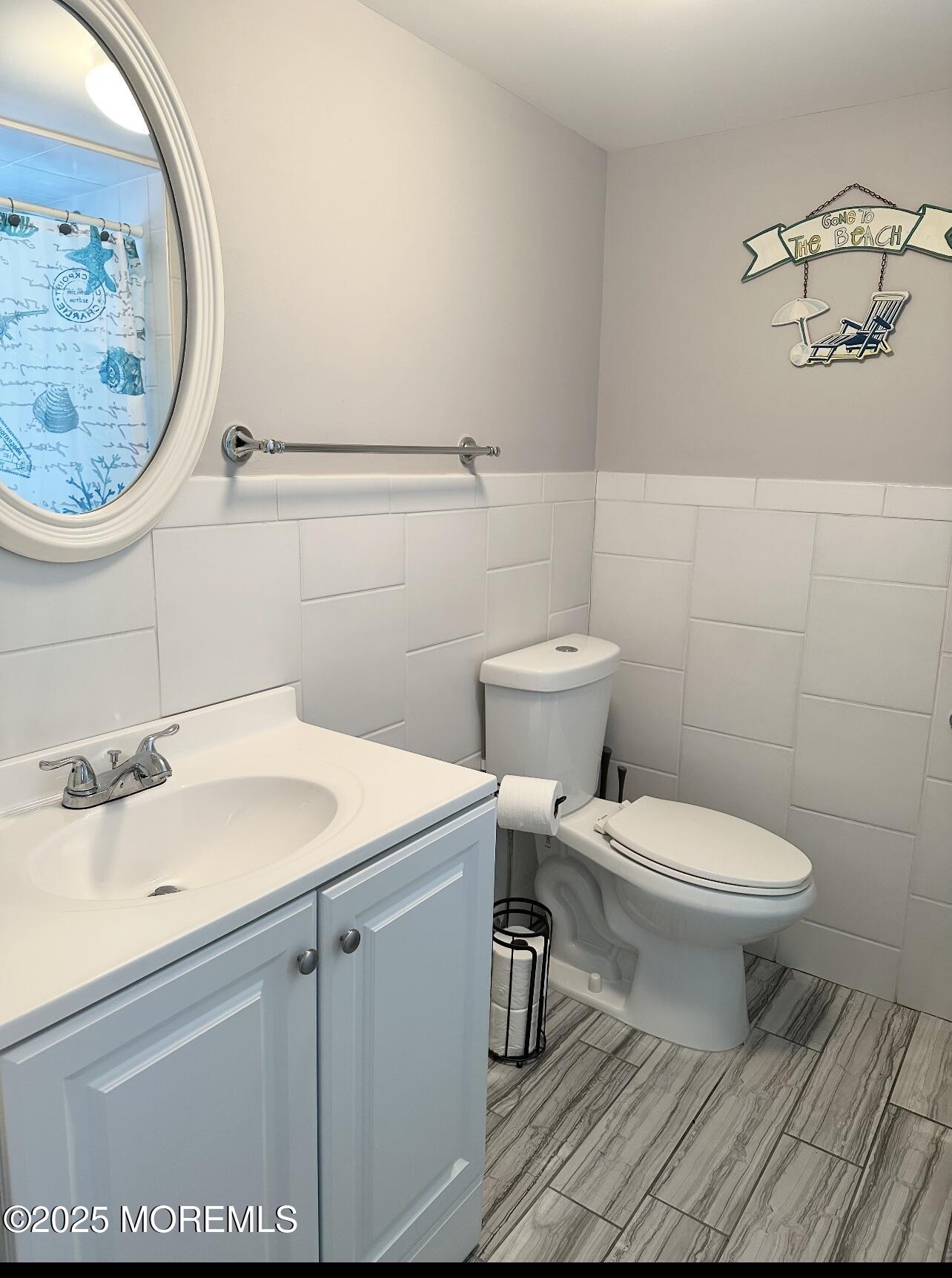 7 Princeton Avenue Lavallette, NJ 08735 - Photo 14 of 17 a bathroom with a sink and a toilet