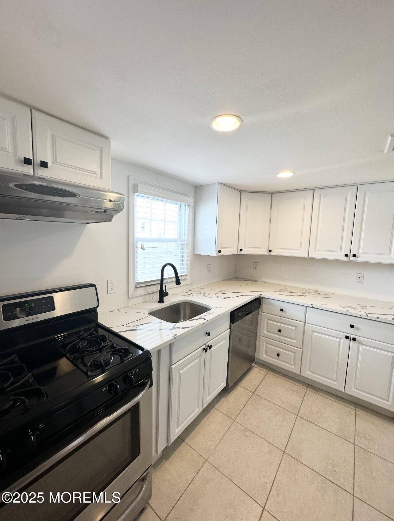 7 Princeton Avenue Lavallette, NJ 08735 - Photo 2 of 17 a kitchen with a stove sink and cabinets