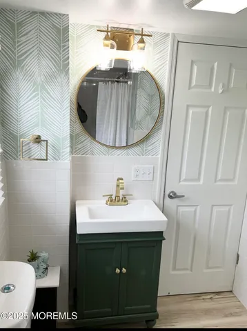 a bathroom with a sink and a mirror