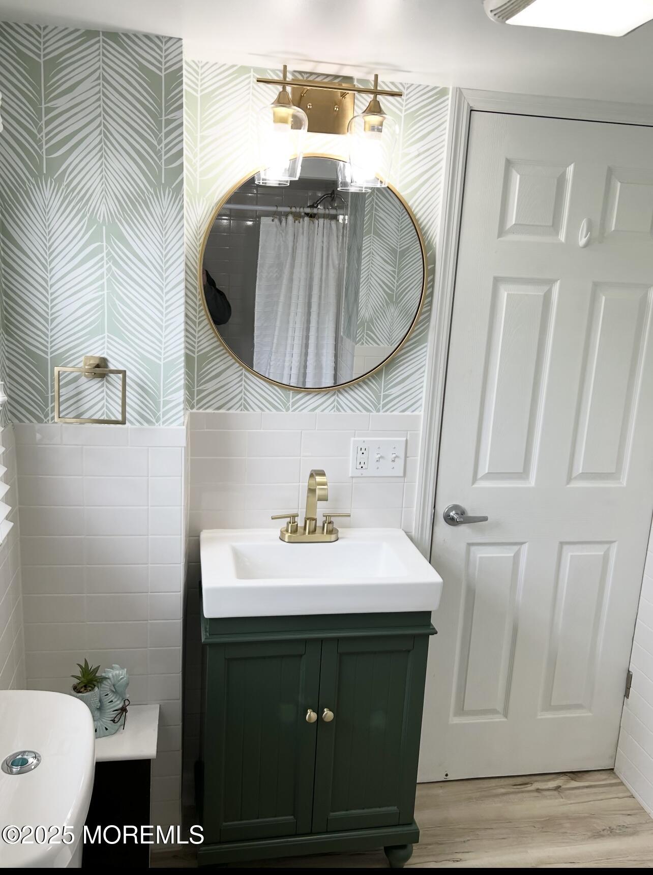 7 Princeton Avenue Lavallette, NJ 08735 - Photo 7 of 17 a bathroom with a sink and a mirror