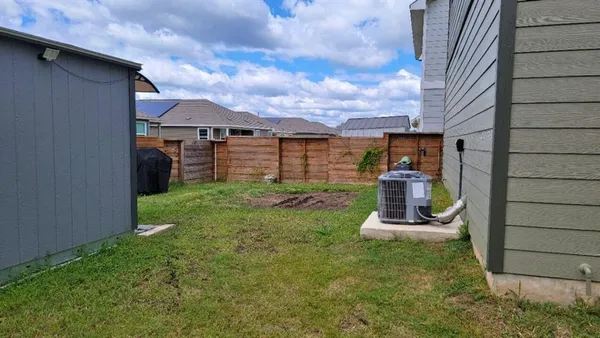 a view of a back yard of the house