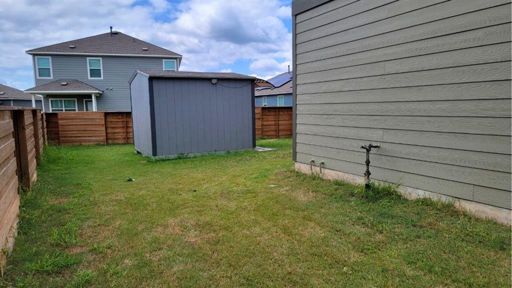 260 Rioja, Unit GARAGE APARTMENT Kyle, TX 78640 - Photo 13 of 13 a view of a backyard