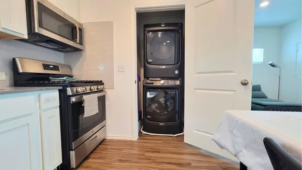 a kitchen with stainless steel appliances a stove and a refrigerator