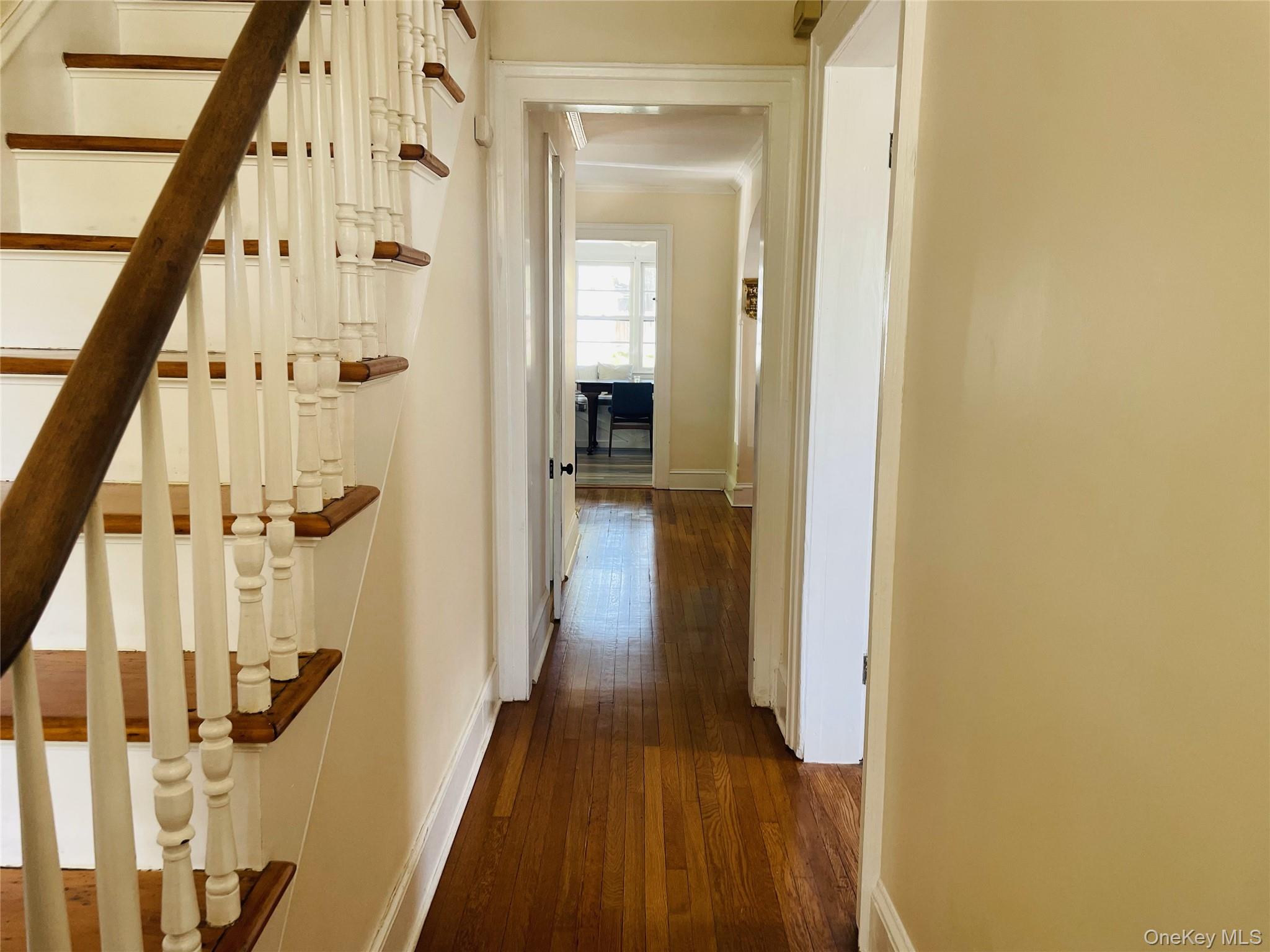 12 Parrott Street Cold Spring, NY 10516 - Photo 7 of 18 Hall featuring baseboards, wood finished floors, and stairs