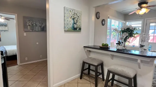 a bedroom with bed and wooden floor