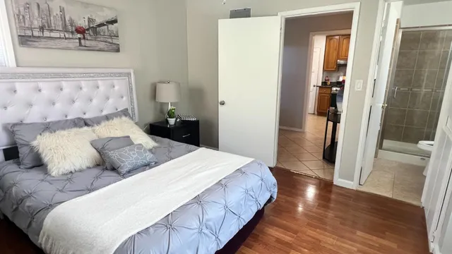 a living room with furniture and a mirror