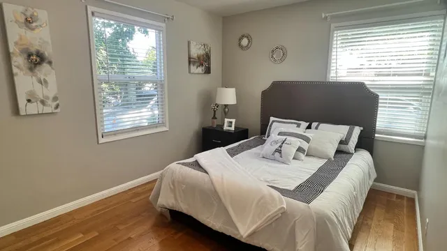 a bedroom with a bed and a window