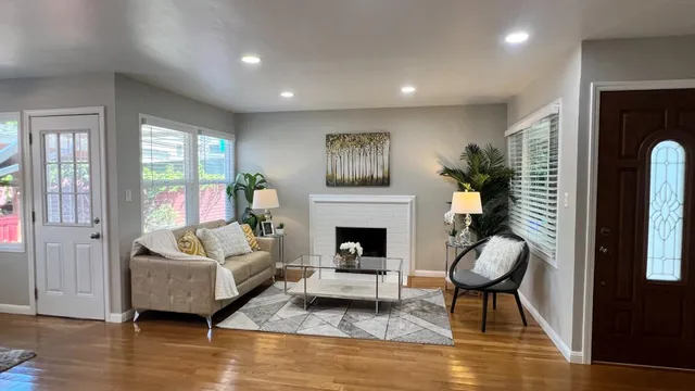 a outdoor dining space with furniture and wooden floor