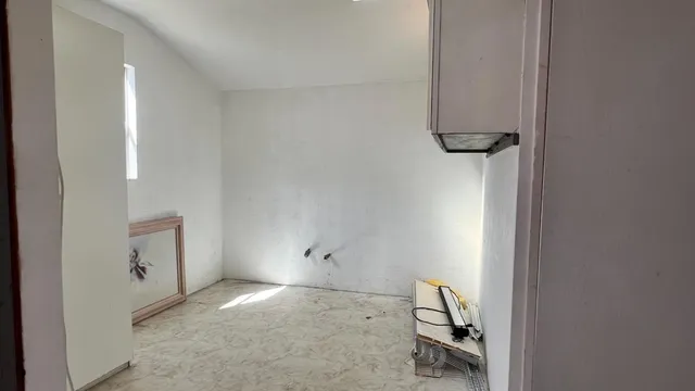 a kitchen with stainless steel appliances granite countertop a stove a refrigerator and a sink