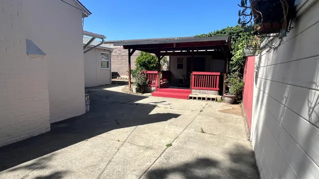 a view of storage and utility room with racks on the wall